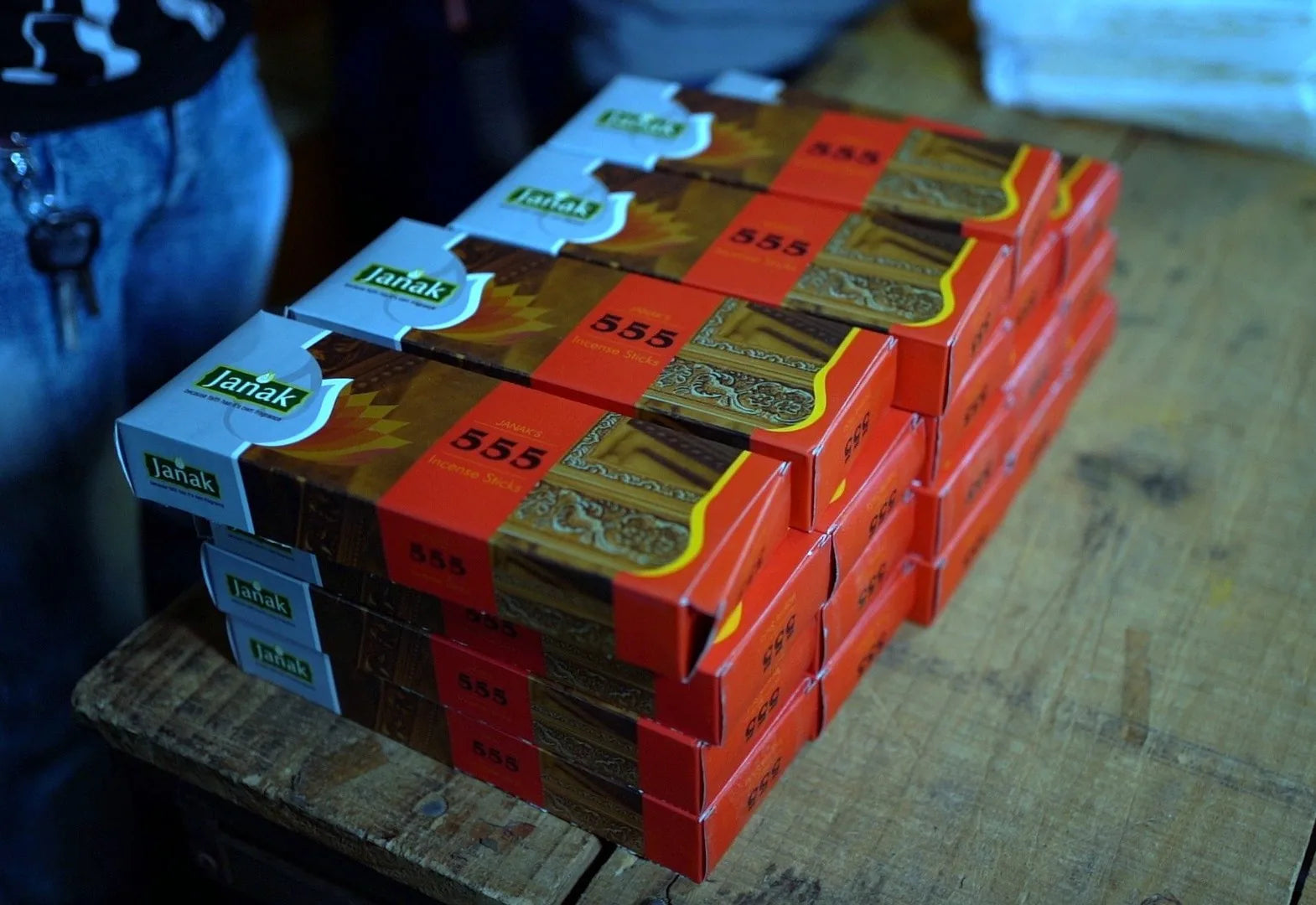 Freshly packed Janak 555 boxes stacked on a work table at the Rajkot factory